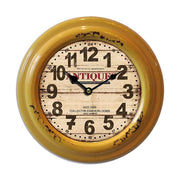 Vintage illetve loft stílusú, antikolt fém felületű falióra "Antiques" felirattal