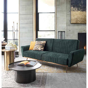 Modern, kortárs stílusú, fekete színű, nikkelezett acélból készült, kör alakú dohányzóasztal, zöld kanapéval modern nappaliban. 