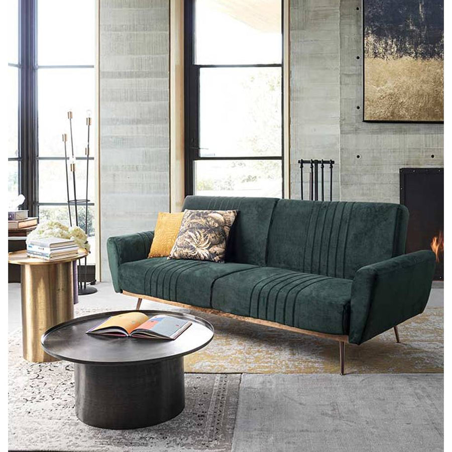 Modern, kortárs stílusú, fekete színű, nikkelezett acélból készült, kör alakú dohányzóasztal, zöld kanapéval modern nappaliban. 