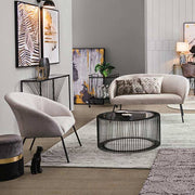 Porfestett, fekete színű acélból készült, sötét színű edzett üvegű, modern, kortárs stílusú kör alakú dohányzóasztal.