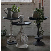 Antikolt felületű, fémből és műgyantából készült, fekete és krém színű lerakó kisasztal.