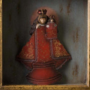 Szoborfülkés fa képkeretbe foglalt,, a Gyógyító Szűzanyát ábrázoló figura.