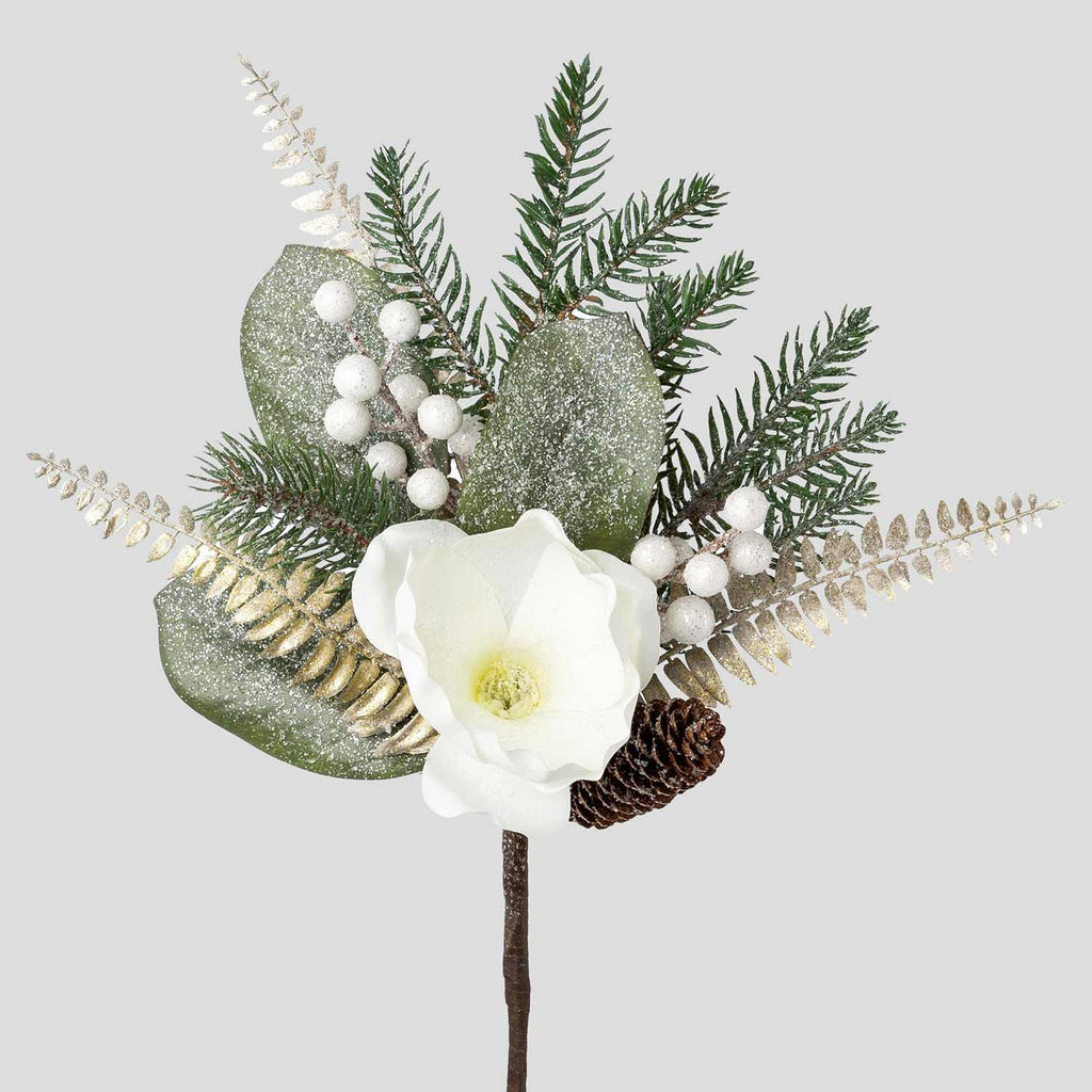 Fehér színű magnóliavirággal, pezsgőszínű páfrány levelekkel díszített, deres hatású fenyőág műnővény.