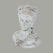 Női mellszobor formájú,, antikolt felületű cementből készült kaspó büszt.