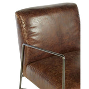 Natúr színű vasból készült, barna színű marhabőrrel kárpitozott, kortárs-loft stílusú, formatervezett prémium karosszék.