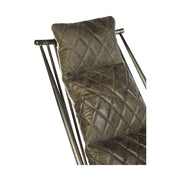 Vasból készült, vintage ébenfa színű marhabőrrel kárpitozott, kortárs-loft stílusú, formatervezett prémium pihenő karosszék.