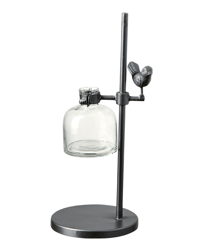 Loft stílusú,, madárral díszített, fém lombikállványba helyezett üveg váza.