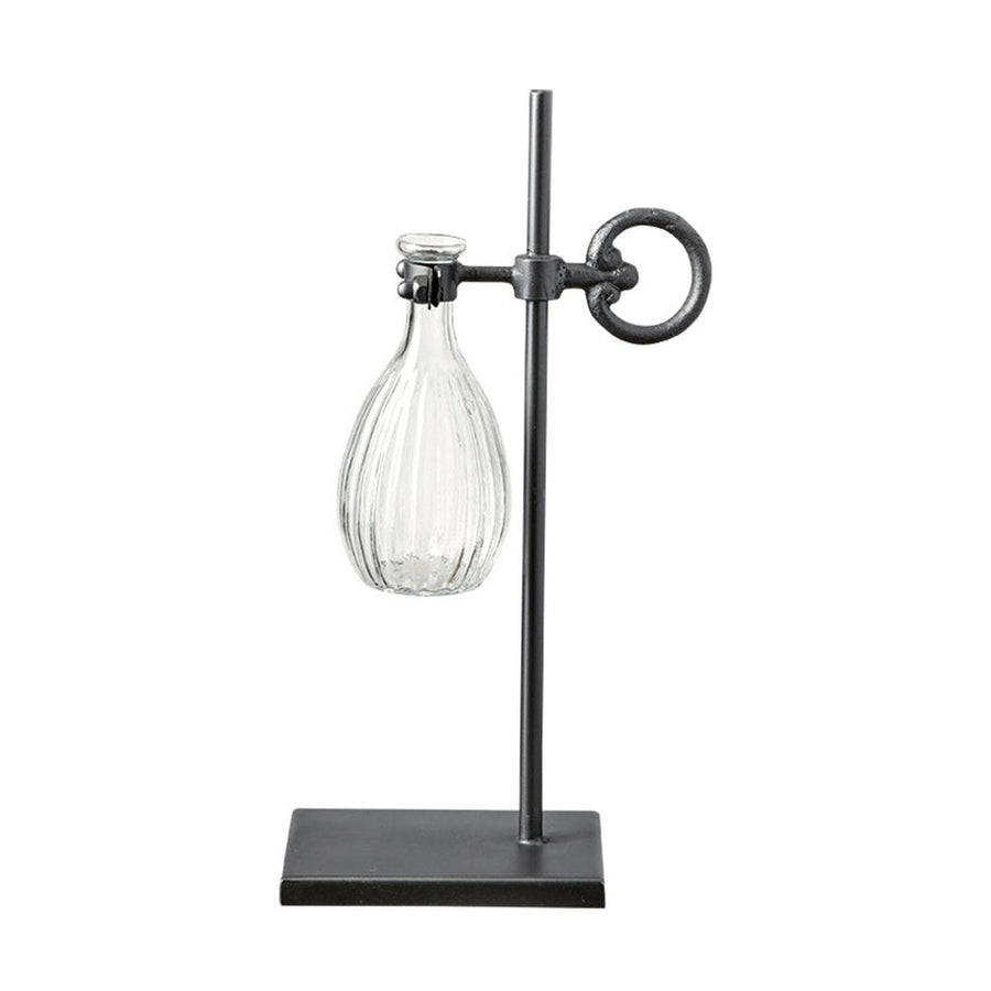 Loft stílusú,, fém lombikállványba helyezett üveg váza.
