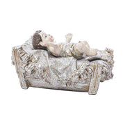 Karácsonyi betlhem kis Jézus figurája jászolban