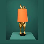 Aranyszínű, nyuszi figurás, glamour stílusú, asztali lámpa.