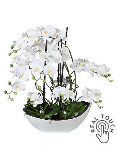 Fehér színű mű orchidea, csónak formájú kerámia kaspóban.