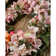 Élethű mesterséges művirágokból készült, szaténszalagokkal díszített nagyméretű ajtókopogtató koszorú