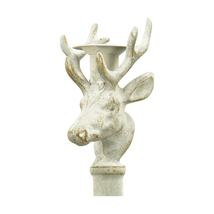 Vintage stílusú, rusztikus patinás felületű, antik fehér színű, szarvasfejjel díszített fém gyertyatartó.