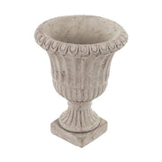 Antikolt felületű, szürke színű talpas cement kaspó.