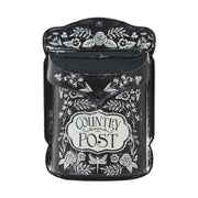 Vintage stílusú, fémből készült, fehér színű növényi dombormintával díszített, "Country Post" feliratú antik fekete dekor postaláda