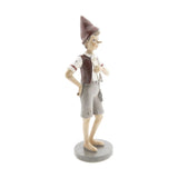 Vintage stílusú, tarisznyát viselő Pinokkió-figura.