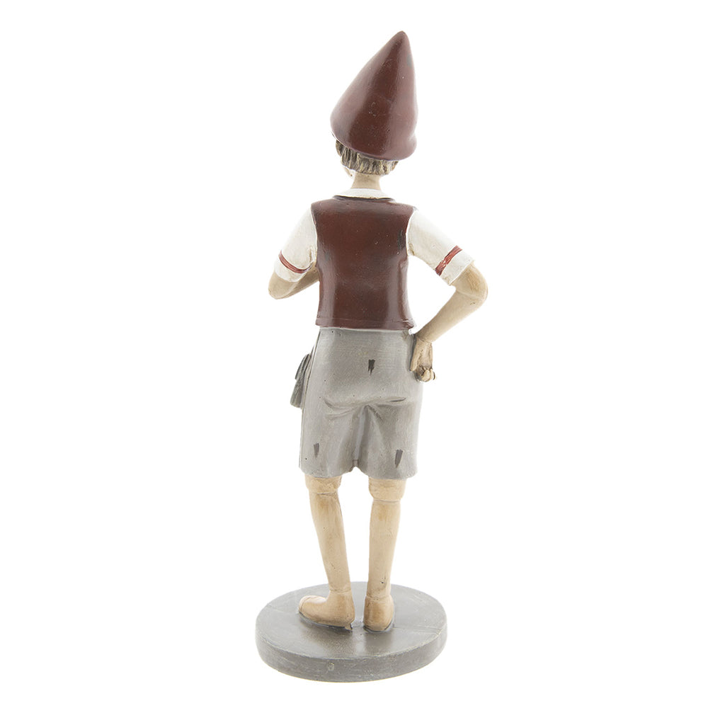 Vintage stílusú, tarisznyát viselő Pinokkió-figura.